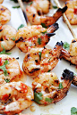 Shrimp skewers on bamboo sticks.