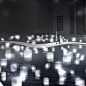 The Passing on Project is a collaboration between architect Makoto Tanijiri, lighting designer Izumi Okayasu and media producer Yahoko Sasao. The trio created an interactive installation titled Turn Light Into Delight. Visitors select an acrylic block bef