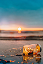 clear glass mason jar on beach during sunset