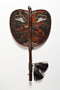 A LACQUERED WOOD UCHIWA FAN-Japan, Edo period (early 19th century). Height 43.5 cm. Wood decorated with lacquer, raden inlays and partial gilding.
