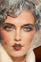 HAIR/MAKEUP - This John Galliano look is an exaggeration of the desired beauty look in the 1920's.: 