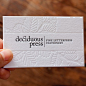 debossed business cards , like smooth center stripe, also like name on side, line then interior design on other side: 