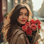 smiling russian woman 25 years old with a bouquet of roses in city