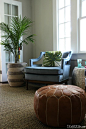 Love the palm tree in a baskets rom HomeGoods paired with club chairs and a leather pouf. Tour this colorful, eclectic, boho living room kellyelko.com sponsored pin