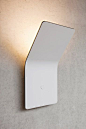 Wall lamp 'One' designed by Matthias, Simon and Jurgen Frech for their company FSING. Made of a 4mm thick alumnium composite hiding all electric systems. Nice.