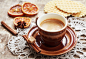 A cup of coffee, lace doily, candied orange, waffles and cinnamo by Olga Phoenix on 500px