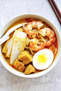 Laksa - Spicy street food noodle dish popular in Malaysia and Singapore. This homemade curry laksa recipe is so easy and delicious | rasamalaysia.com