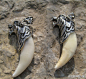复古狼牙骨质吊坠，原始自然、粗犷豪放，给佩带者增添一种野性的魅力。http://mogujie.cn/015FWl