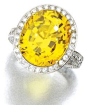 14.32 carat yellow sapphire and diamond ring. Via Sothebys.