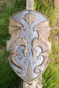 I love the faded metal colours of this shield! The dragons are cool, but not over stated and the sun sigyl at the top just seals the deal. This is such a gorgeous larp shield.  ---  Epic Dragon Knights shield. Larp safe: 
