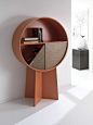 Luna Cabinet - Patricia Urquiola : Luna circular cabinet holds items within a drum-shaped volume divided into compartments. Its quadrants swing open to reveal the contents stored inside. These quadrants can rotate 90 degrees around the centre of the circl