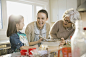 Three generation family baking together during Christmas by Hero Images on 500px