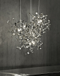 TERZANI S.R.L. - Argent : WITH THIS NEW SUSPENSION LIGHT, DESIGNER DODO ARSLAN CREATES A SHIMMERING, SILVER CLOUD.  ARGENT CONSISTS OF METAL DISCS THAT HAVE BEEN METICULOUSLY SHAPED BY HAND BY TERZANI CRAFTSMEN INTO CLUSTERS.  ONCE LIT, THE MULTIPLE, ANGL