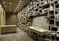 Aesop Fillmore Street by NADAAA : Aesop store in San Francisco by NADAAA with reclaimed timber boxes piled up to the ceiling to create a wall of shelves.