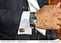 businessman looking at the watch, high key, focus on the watch 正版图片在线交易平台 - 海洛创意（HelloRF） - 站酷旗下品牌 - Shutterstock中国独家合作伙伴