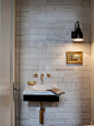 Example of a transitional marble tile powder room design in Chicago with a wall-mount sink