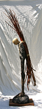 To carry the old forest burdens. by William Catling, c. 2010 Ceramic, wood and twine 108” x 18” x 30”: 