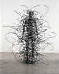 This fascinating wire sculpture has used the density of the wires to represent a person's silhouette, only by bending the wires.