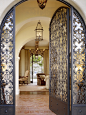 Enchanted Oaks : Keeping in mind the 1920's Mediterranean vernacular of this newly-built hacienda, we used strong Spanish-style design elements - terracotta floors, hand-hewn beams, plaster walls , steel doors - and