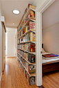 If we lined the corridor wall with bookshelves like this where would I put all the pictures.  Aha, back up the stairs wall.: 