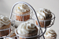 White Icing Brown Cupcake on White Metal