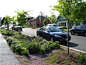 10 Ways to Use Low-Impact Development to Reduce Your Stormwater and Urban Runoff Pollution (SWURP) Footprint; Streetside swale Seattle