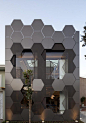 SuperLimão Studio have designed a honeycomb inspired facade, full of hexagonal shapes, for the Estar Móveis shop in São Paulo, Brazil