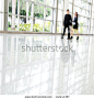 Business people rushing in the lobby. motion blur - stock photo