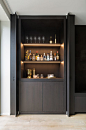 Pivot sliding doors conceal the bar