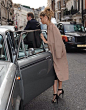 Camel coat + black heels.