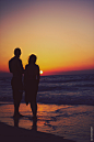 Young Couple On The Beach At Sunset : Young Couple On The Beach
