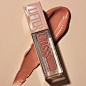 Photo by Maybelline New York on January 12, 2023. May be an image of ‎saddle-stitched leather, cosmetics and ‎text that says '‎GLOSS MAYBELLINE AYBE ELLINE ACIDE HYALURONIC مس HYALUBONI 5.4ml/018FI HYALURONIC ACIDEHYALURONIOU AGIo ACID 07 UE‎'‎‎.
