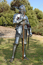 7060332-15th-century-english-knight-in-shining-armour-standing-outside-with-battle-axe-Stock-Photo.jpg (863×1300)