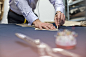 Tailor marking fabric in menswear workshop by Caia Images on 500px