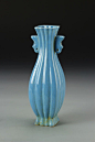 China, blue glazed vase, in a four sided form, with a scalloped surface, two decorative handles, and a bright blue glaze, mark on base. Height 9 in.
