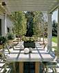 I like the pergola-covered eating area