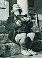 "New Shoes" by Gerald Waller, Austria 1946 : Six year-old Werfel, living in an orphanage in Austria, hugs a new pair of shoes given to him by the American Red Cross.  This photo was published by Life magazine.