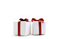 Closeup of two little gift boxes with red ribbons by Violeta Chalakova on 500px