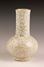 Small white crackle glazed porcelain vase, China, Song Dynasty style, with long neck, Qing Qianlong mark on base, 6 3/4"h.