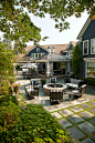 Inspiration for a large timeless backyard patio kitchen remodel in Detroit with a roof extension