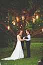 Romantic Mason jar lighting illuminates this rustic wedding