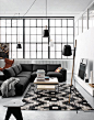 Black, white, wood decor in Copenhagen studio apartment...