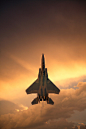 F-15 Eagle going vertical through the clouds near dusk. 