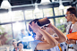 Woman trying virtual reality stimulator glasses at technology conference by Caia Images on 500px