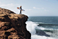 Justine Dupont looking down to see the huge waves. Yesterday she surfed a 15m wave in Nazaré. by Lyes Kachaou on 500px