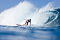 A water view of a woman surfing at Pipeline, on the north shore of Oahu, Hawaii. by Adventure Joe on 500px