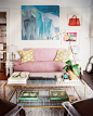 Living Room Photo - Artwork hung above a purple couch: