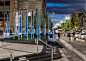 The Prudential Center at 888 Boylston Street / Mikyoung Kim : A collection of tall, slender, stainless steel light columns with wind vanes, standing nearly fifteen feet tall, are positioned among a grove of trees within planters to provide a whimsical and