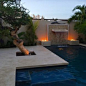 Photo of a mid-sized tropical full sun courtyard stone landscaping in Other for winter.