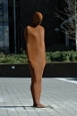 This unique cast iron sculpture by Antony Gormley is called Together and Apart. The students often refer to him as Brown Thomas and he features regularly in graduation portraits.: 